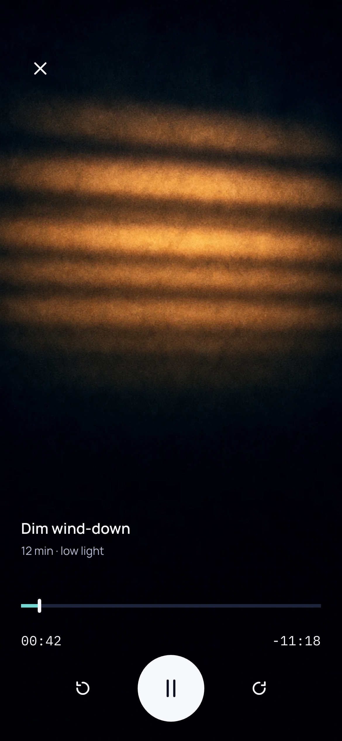 A band cut from the Guided Session: soft horizontal bars of warm amber light lying across a dark room, with no interface chrome over them.